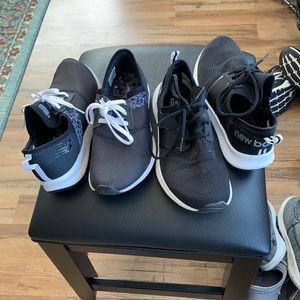 Two pairs of New Balance sneakers.